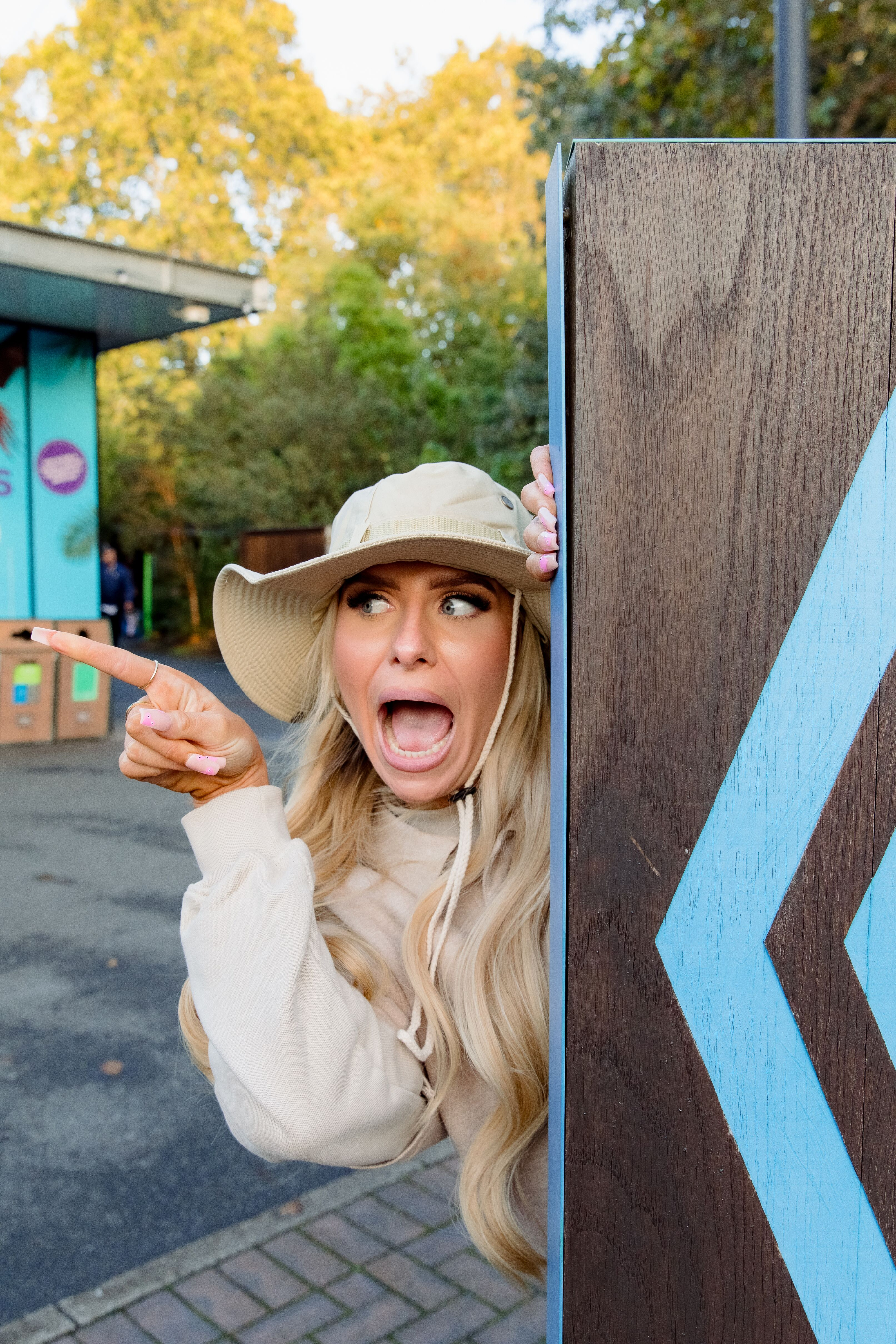 Young woman pointing excitedly